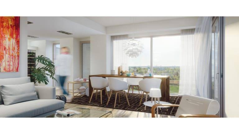 Asunnon valoisa olohuone ja ruokailutila.